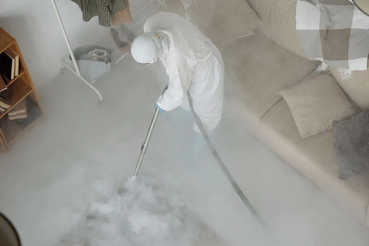 Biohazard cleanup technician in protective equipment, La Presa, CA